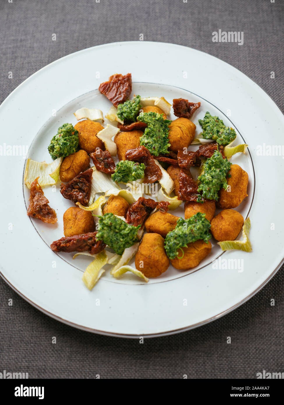 Winter Squash Gnocchi with Roasted Fennel and Spinach Pesto Stock Photo