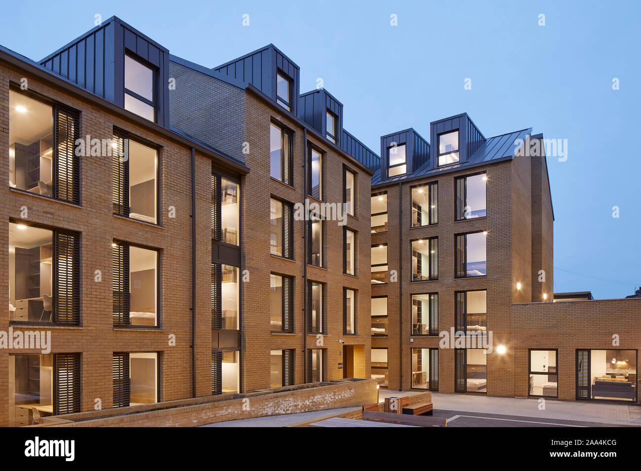 Dusk view of illuminated blocks. Anglia House, Cambridge