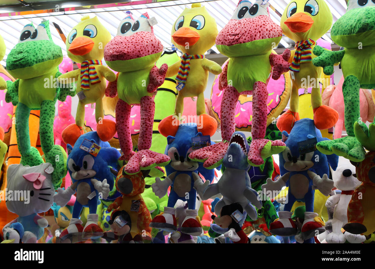 Funfair. Fairground. Stall. Colourful toys. Feria. Andalucia Spain. Full frame. No people. Stock Photo