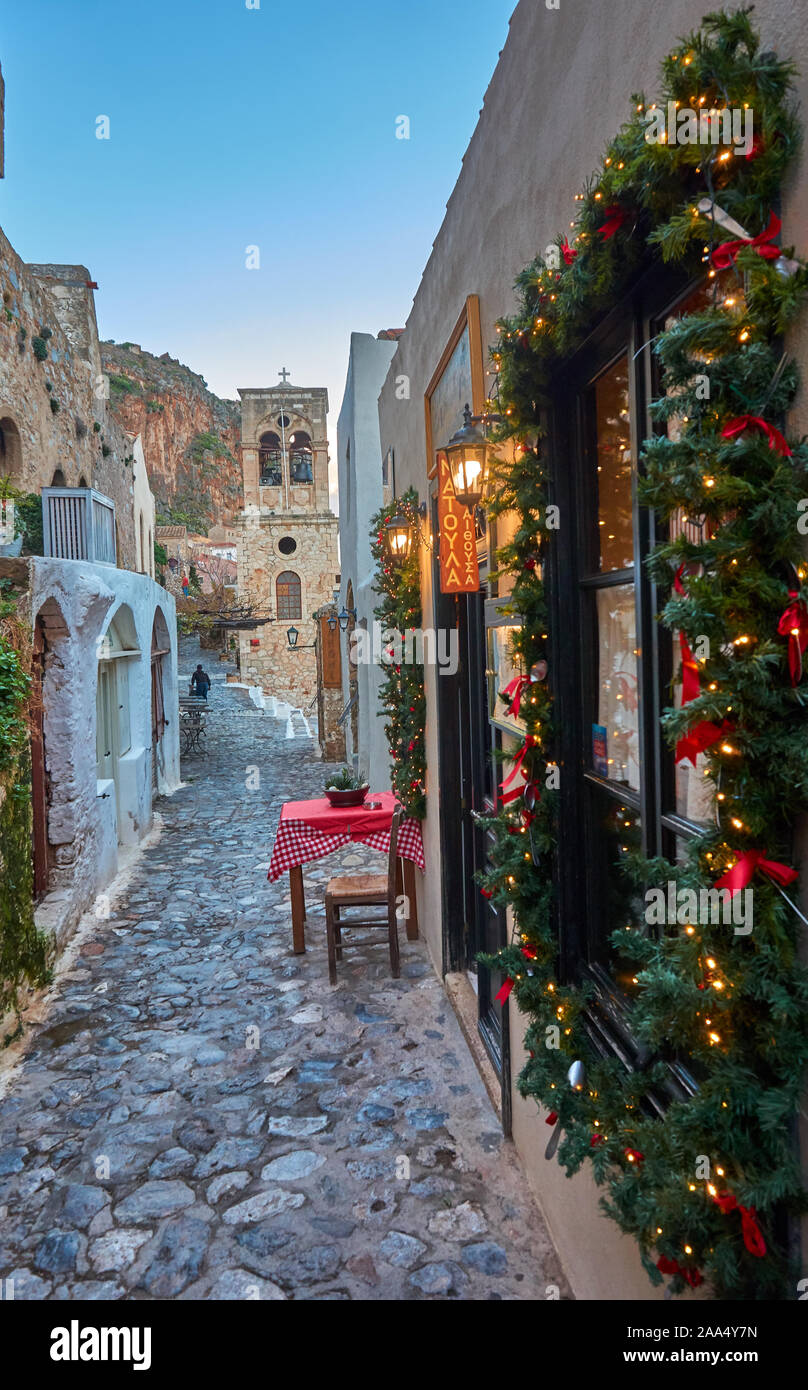 Christmas atmosphere in the medieval castle town of Monemvasia, Greece. Decorated store fronts for christmas in Monemvasia, Laconia, Stock Photo