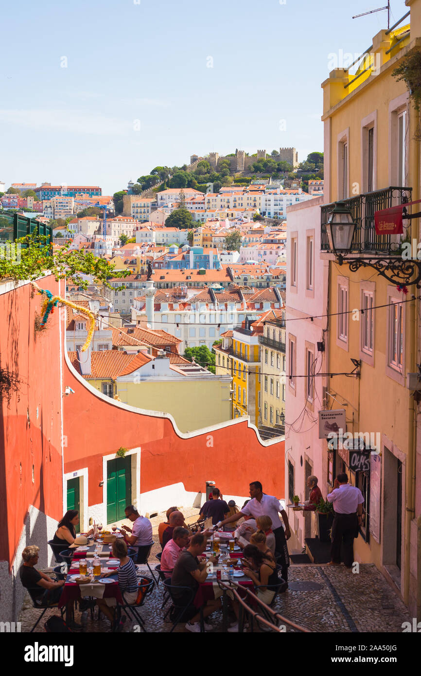 LISBON, PORTUGAL - SEPTEMBER 13, 2019: Outdoor cafe on the old streets of Alfama, overlooking Baixa Stock Photo