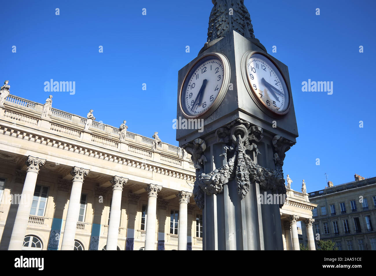 Close up of the clock in Place de la Comédie, with the beautiful Grand Theatre in the background in the center of the city, Bordeaux, France. Stock Photo