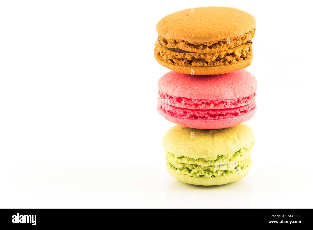 Three Fresh Colorful Macaroons Isolated on White Background. Stock Photo