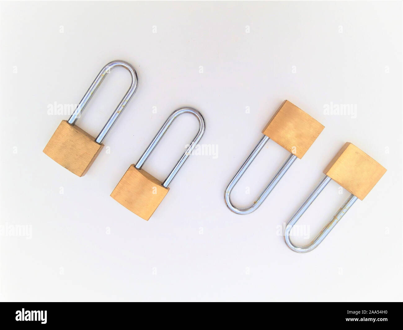 four rusty padlock on a white background Stock Photo - Alamy