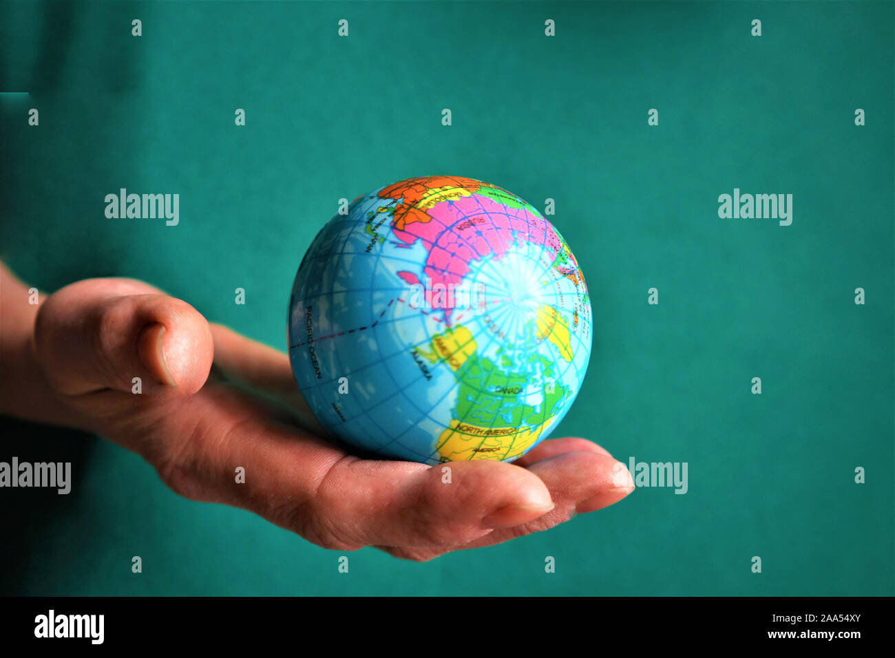 Woman holding globe on hands hi-res stock photography and images - Alamy