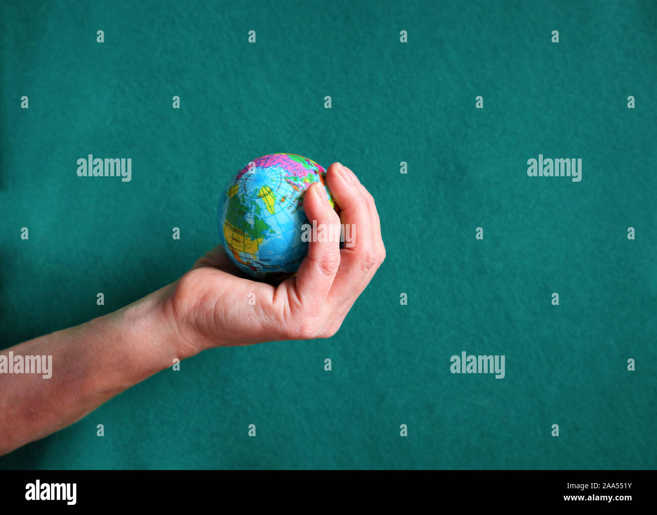 Woman holding globe on her hands, Hands of woman holding globe Stock Photo