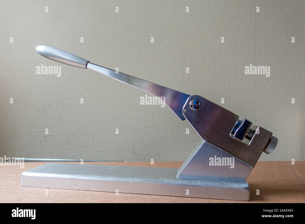 on a silver table stands a bending press for bending surgical metal plates Stock Photo Alamy