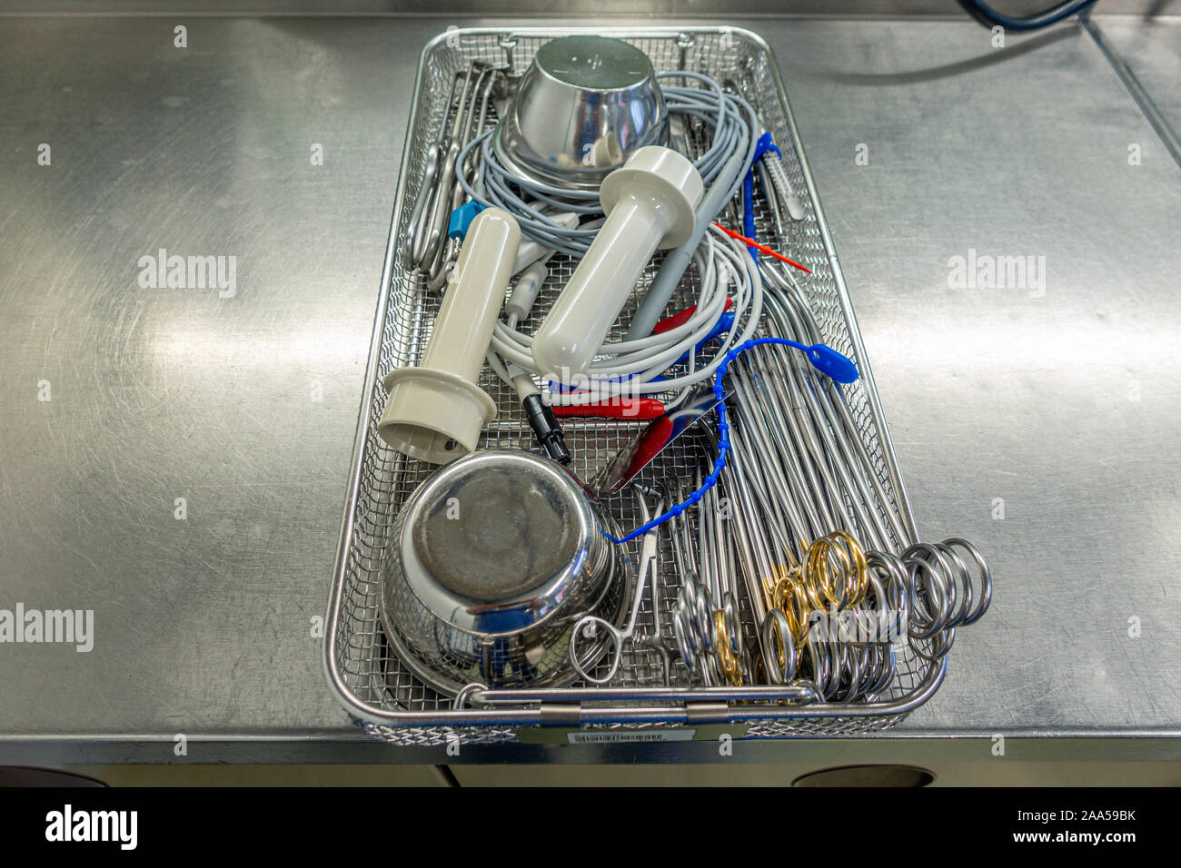 a tray for surgical instruments contains various assorted instruments