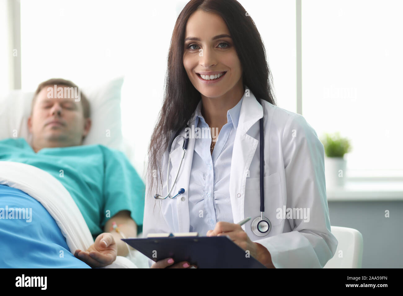 Doctor visiting unhealthy Stock Photo Alamy