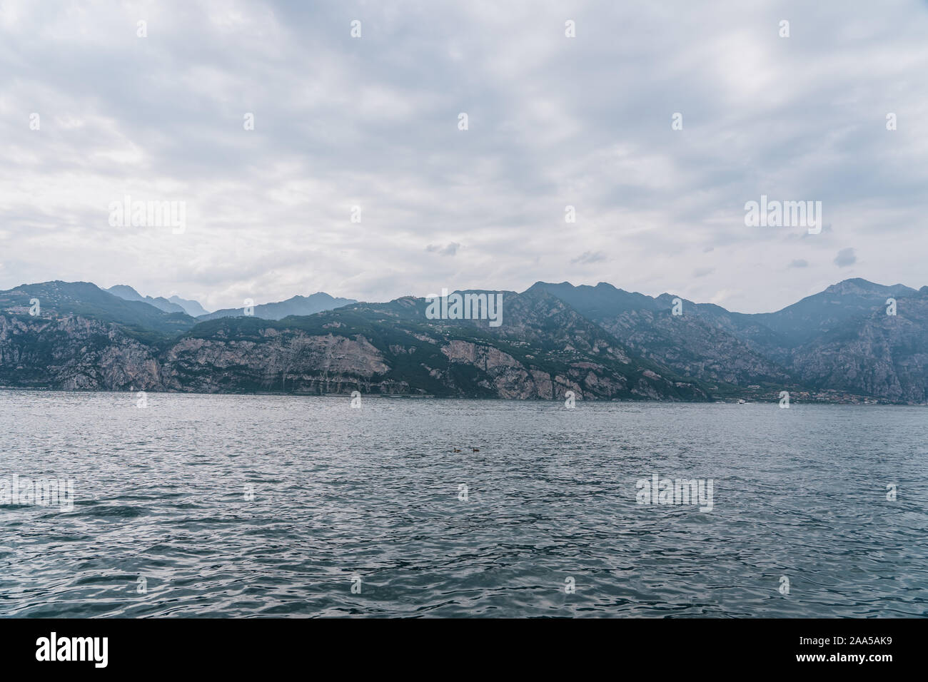 Mountain ridge in clouddy days by lake garda in Veneto, Italy Stock Photo