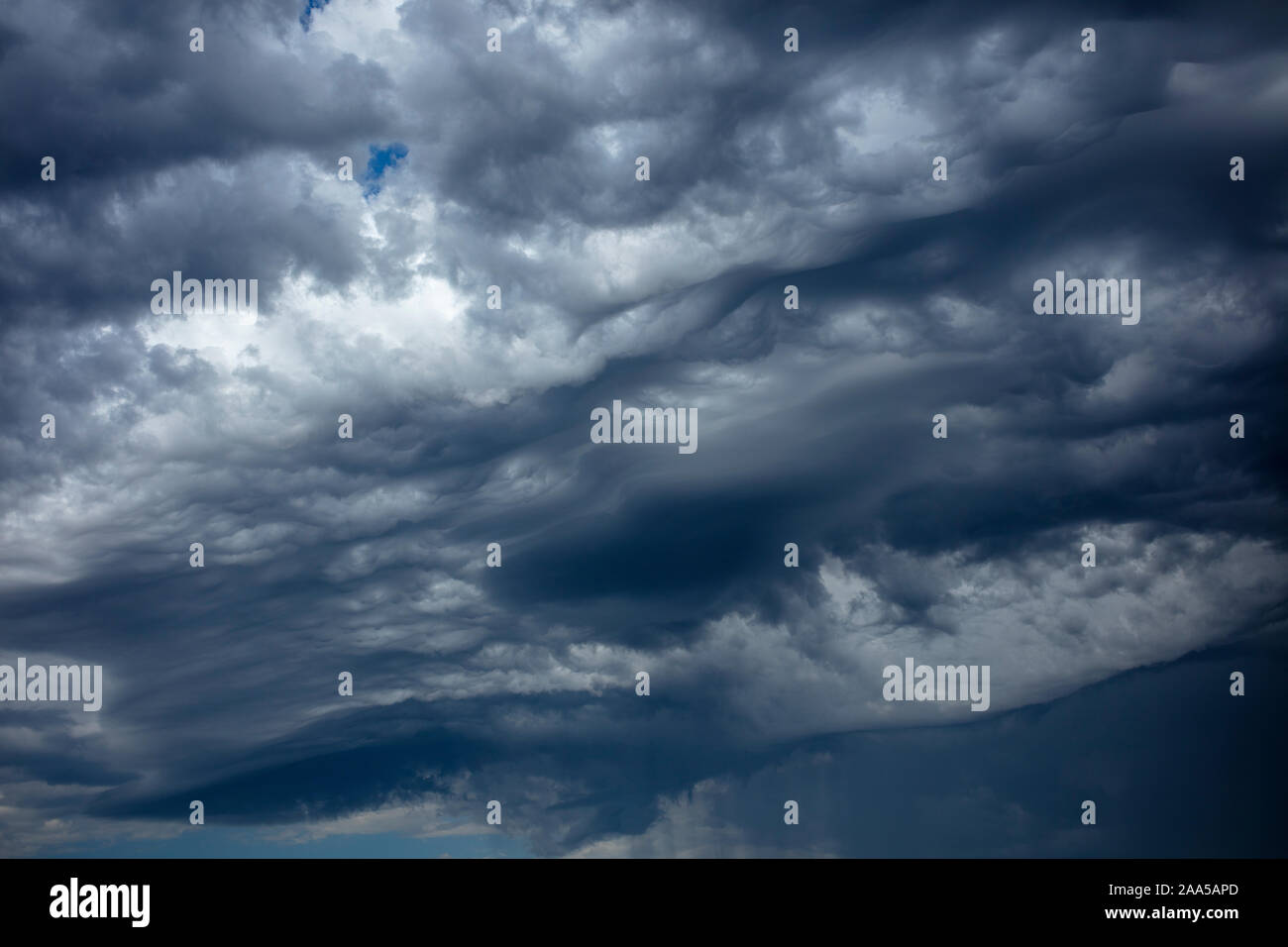 Grey clouds accumulating during a winter storm Stock Photo