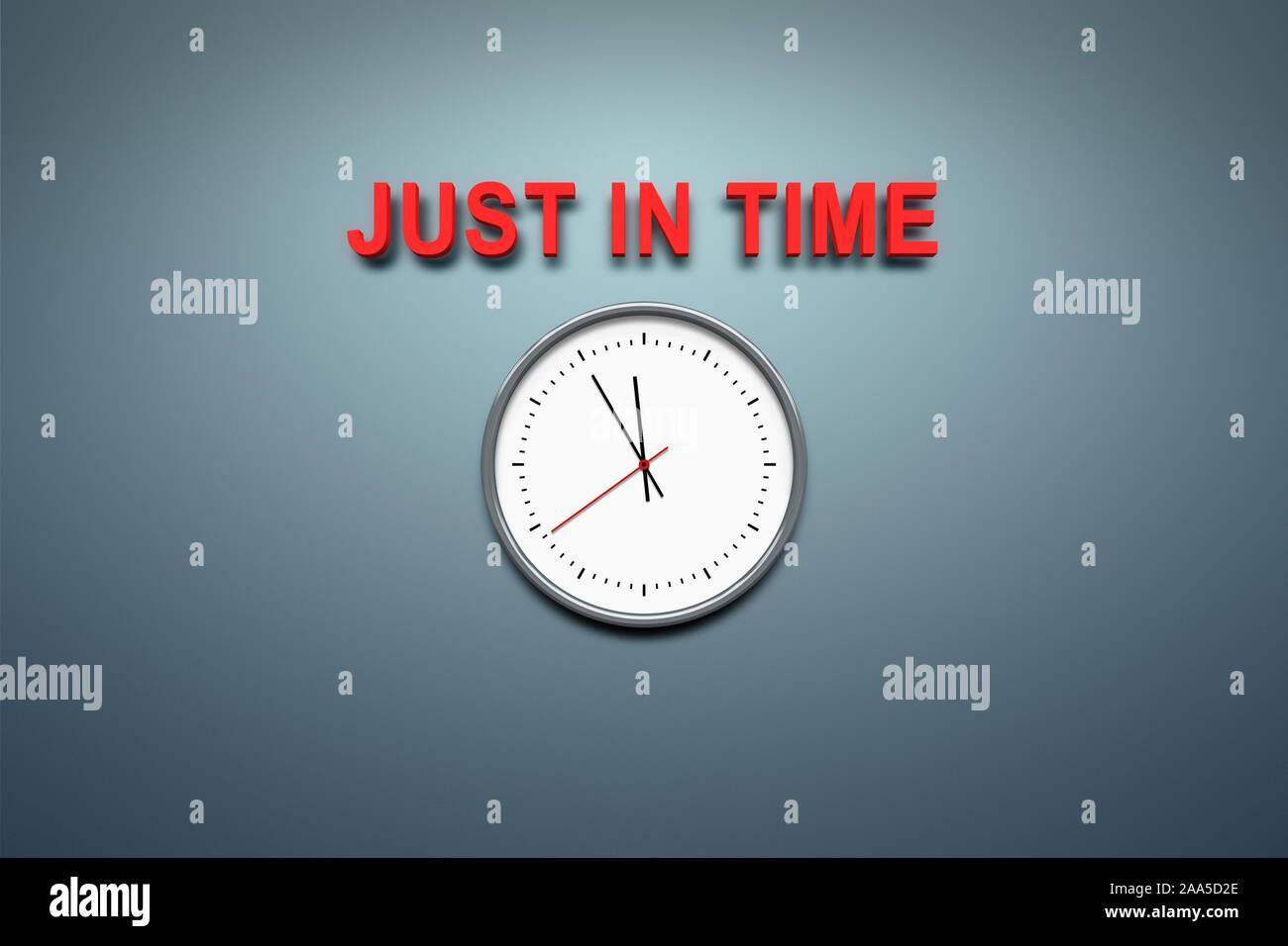 Eine simple Uhr vor grauem Hintergrund, ueber der die Worte 'Just in Time' stehen Stock Photo
