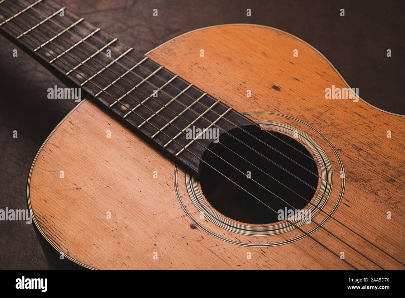 Macro close up music concept acoustic guitar body wooden vintage old fashioned Stock Photo