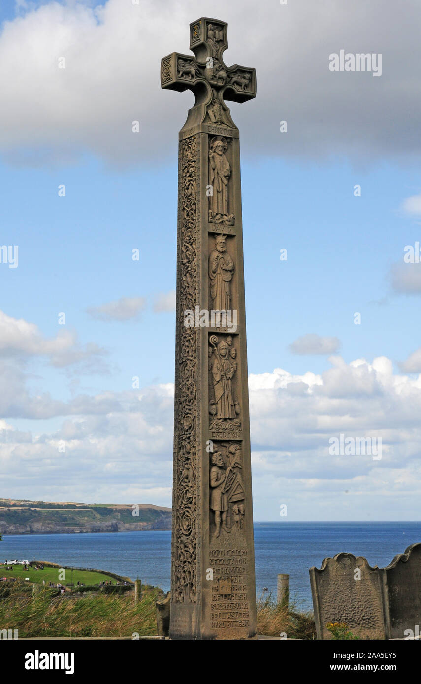 Tall Stone cross in memory of Caedmon, on east Cliff, Whitby. Stock Photo