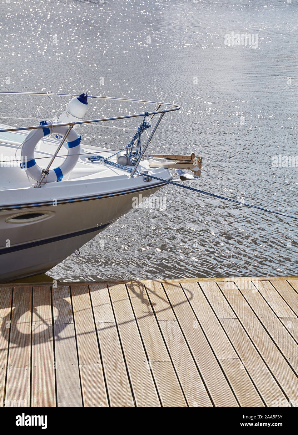 Picture of a boat bow moored to a pier in marina Stock Photo - Alamy