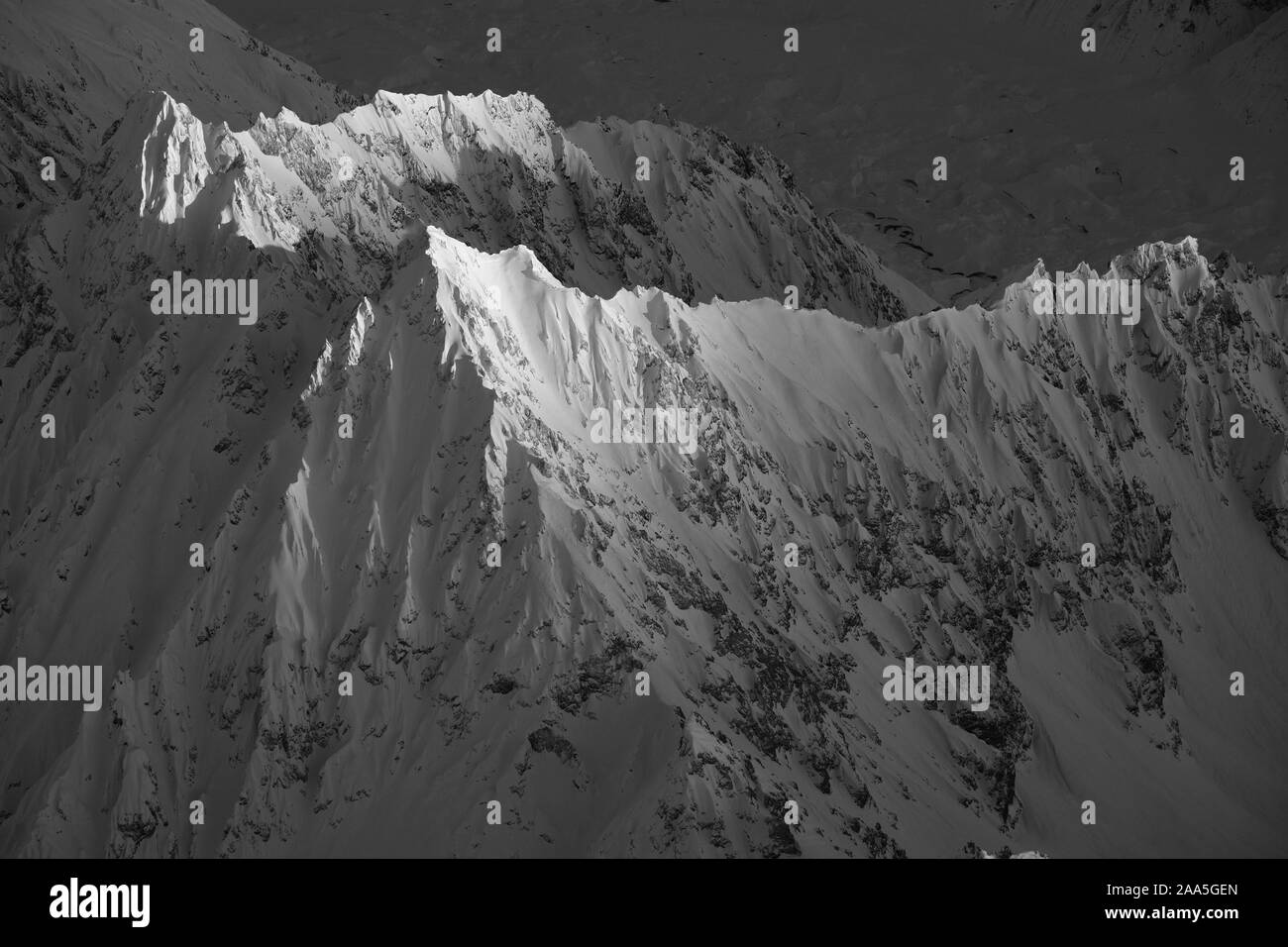 Black and white aerial photo of The Tordrillo Mountains of Alaska, shot in wintertime. Stock Photo