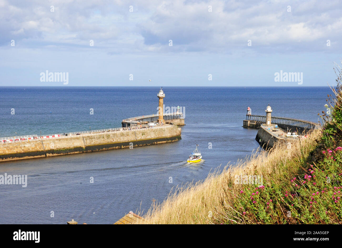 Boat on River Esk leaving Whitby Harbour.  view from Church Steps. Stock Photo