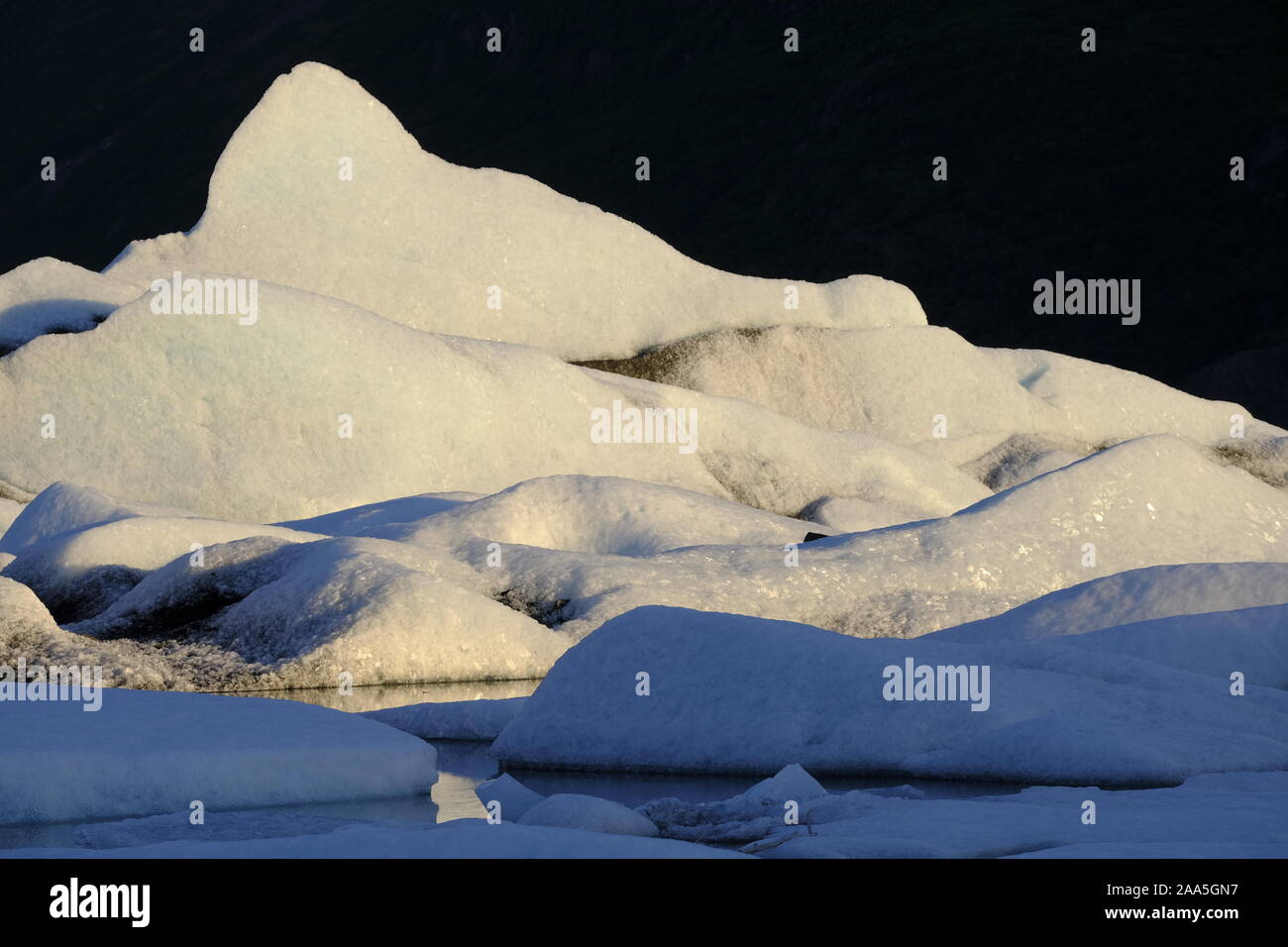 Icebergs floating in the Knik Glacier lagoon, Chugach Mountains, Alaska Stock Photo