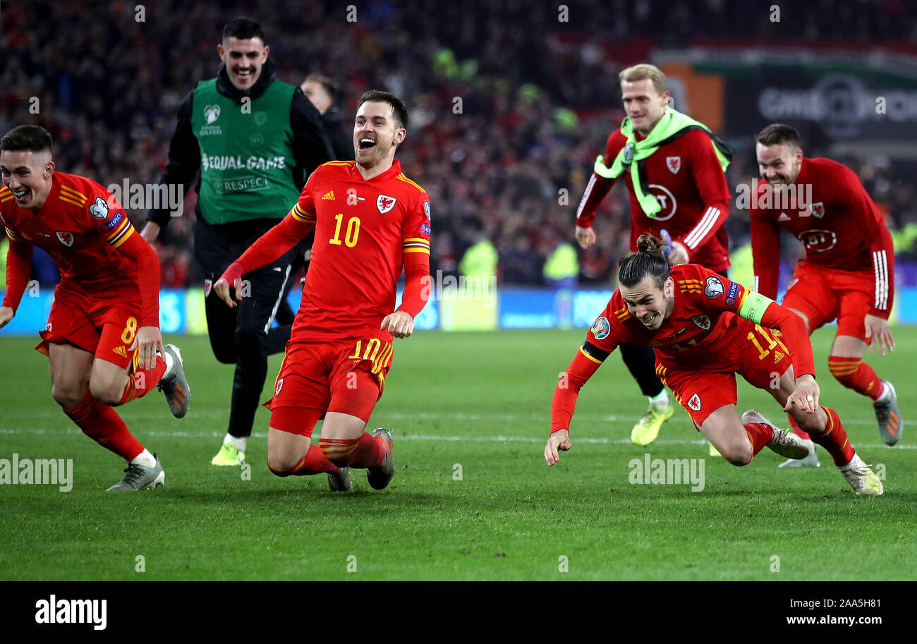 Wales' Harry Wilson (left to right), Aaron Ramsey, Gareth Bale and Ethan Ampadu (right) celebrate victory aand qualification after the final whistle in the UEFA Euro 2020 Qualifying match at the Cardiff City Stadium. Stock Photo
