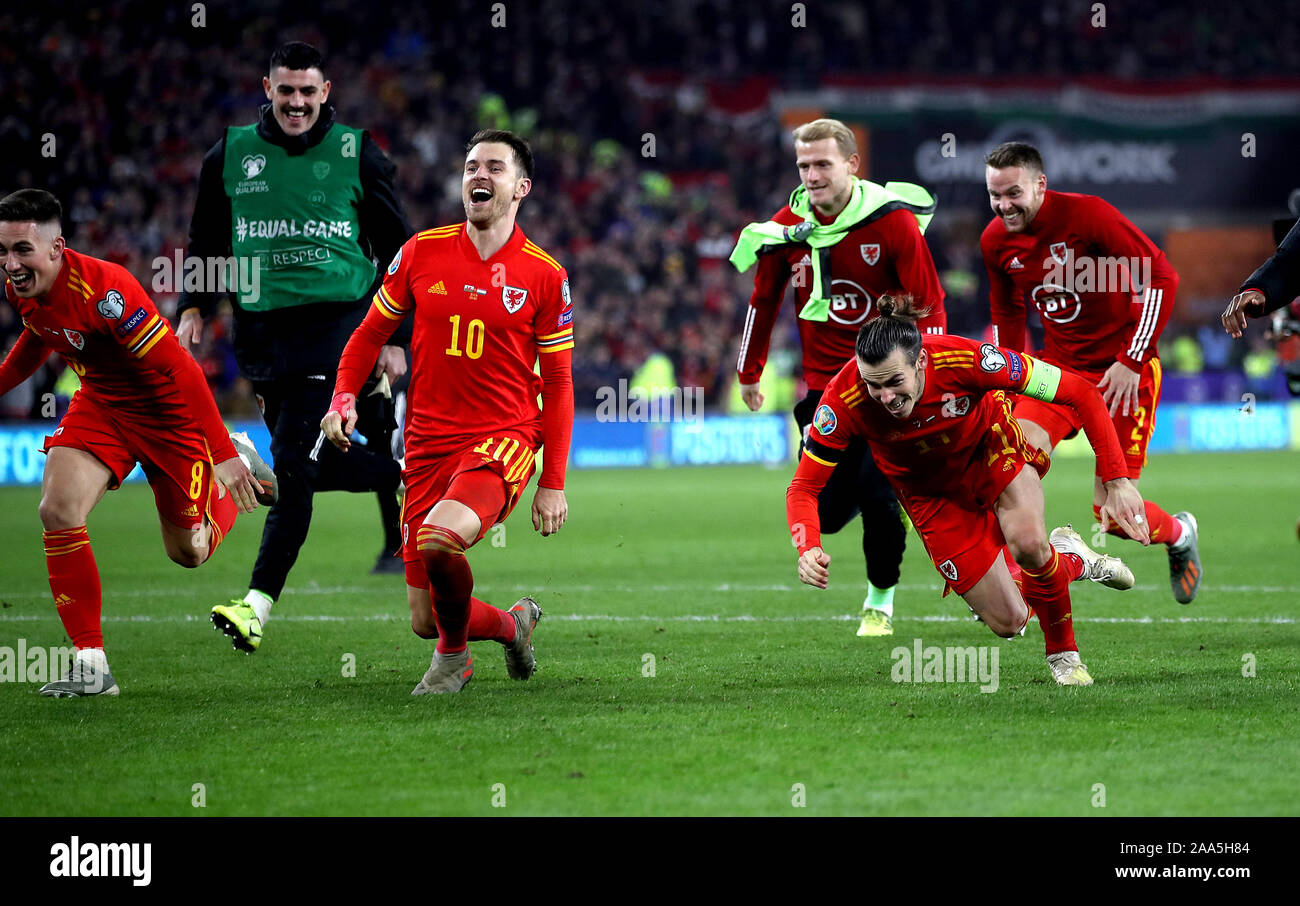 Wales' Harry Wilson (left to right), Aaron Ramsey and Gareth Bale (right) celebrate victory aand qualification after the final whistle in the UEFA Euro 2020 Qualifying match at the Cardiff City Stadium. Stock Photo