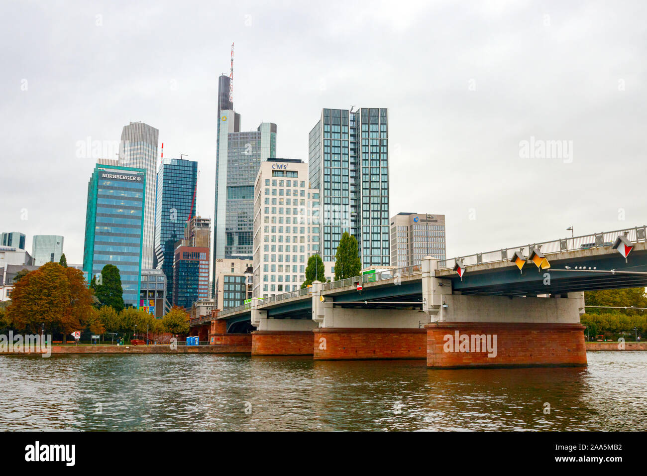 River Main with the Untermainbrucke (Lower Main Bridge) and skyscapers of the Bankenviertel (Central Business Disctrict, CBD). Frankfurt, Germany. Stock Photo