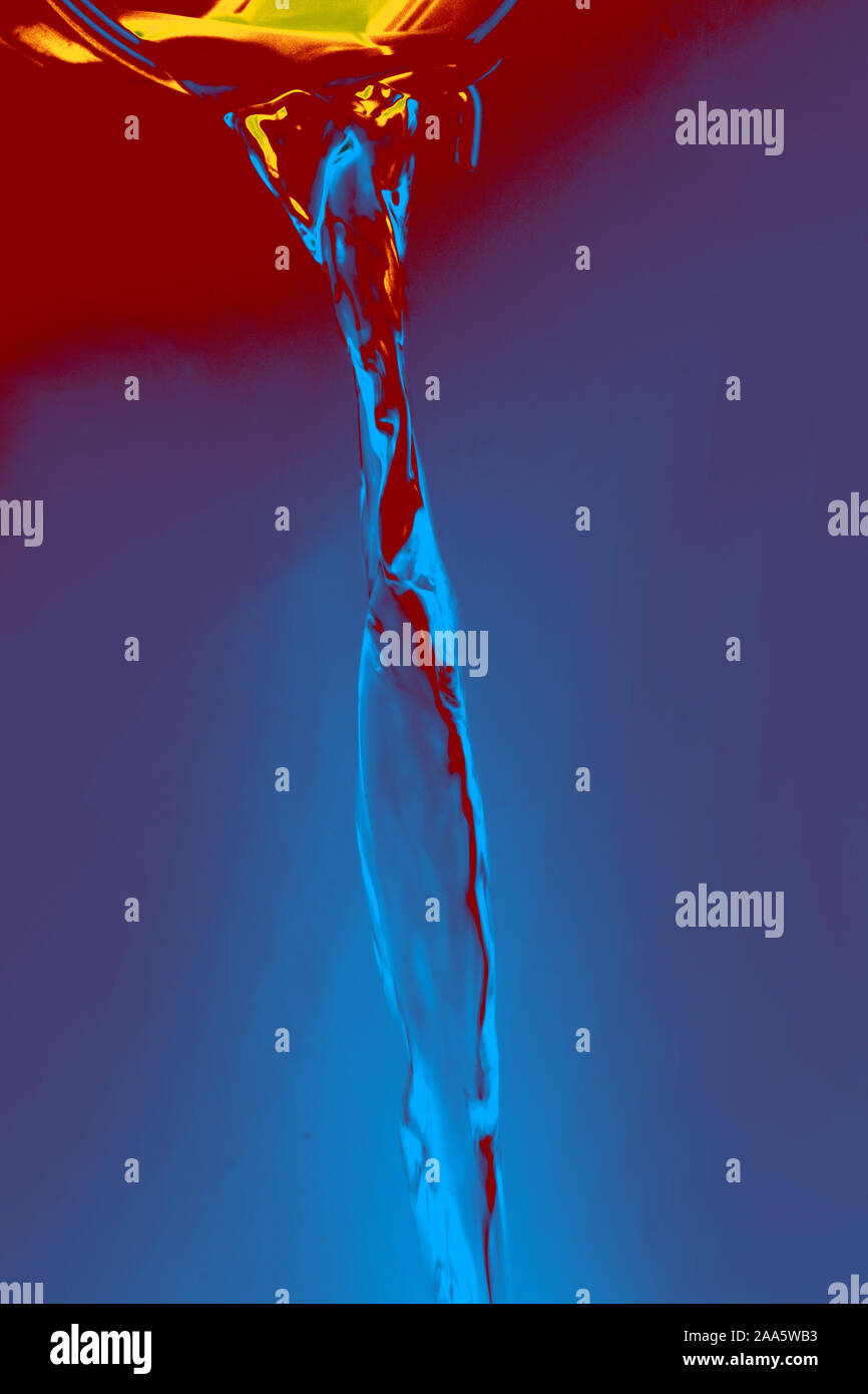 Water flowing out of little yellow bucket Stock Photo Alamy