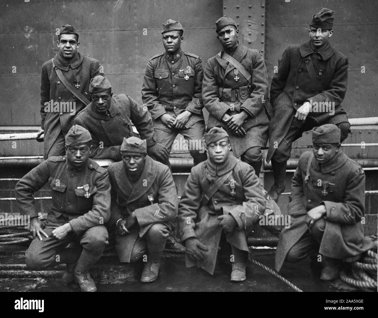 WW I Photos - Colored / African American Troops -New York's Colored Regiment Returns Home on Stockholm. Some of the colored men on 369th (15th N.Y.) who won the Croix de Guerre for gallantry in action. Front row, left to right: Private Eagle Eye, Ed Williams; Lamp Light, Herbert Tayl ca. 2/12/1919 Stock Photo