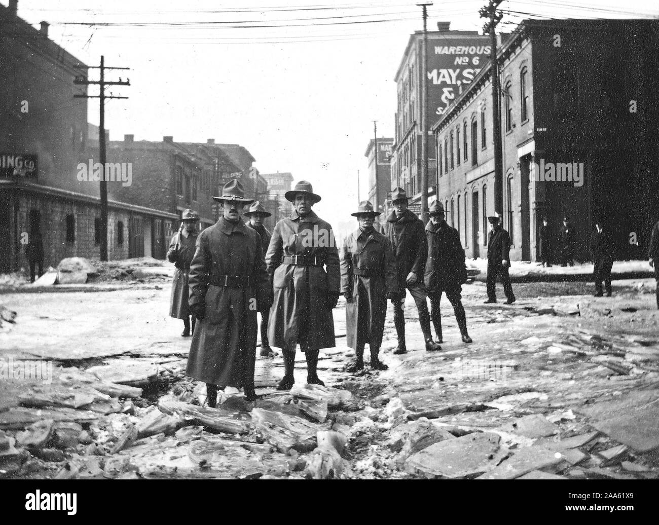 COAL SHORTAGE CAUSE OF INTENSE SUFFERING IN MIDDLE WEST. People of Cincinnati suffered from both cold and flood. Home guard patrolling flood districts ca. 1918 Stock Photo