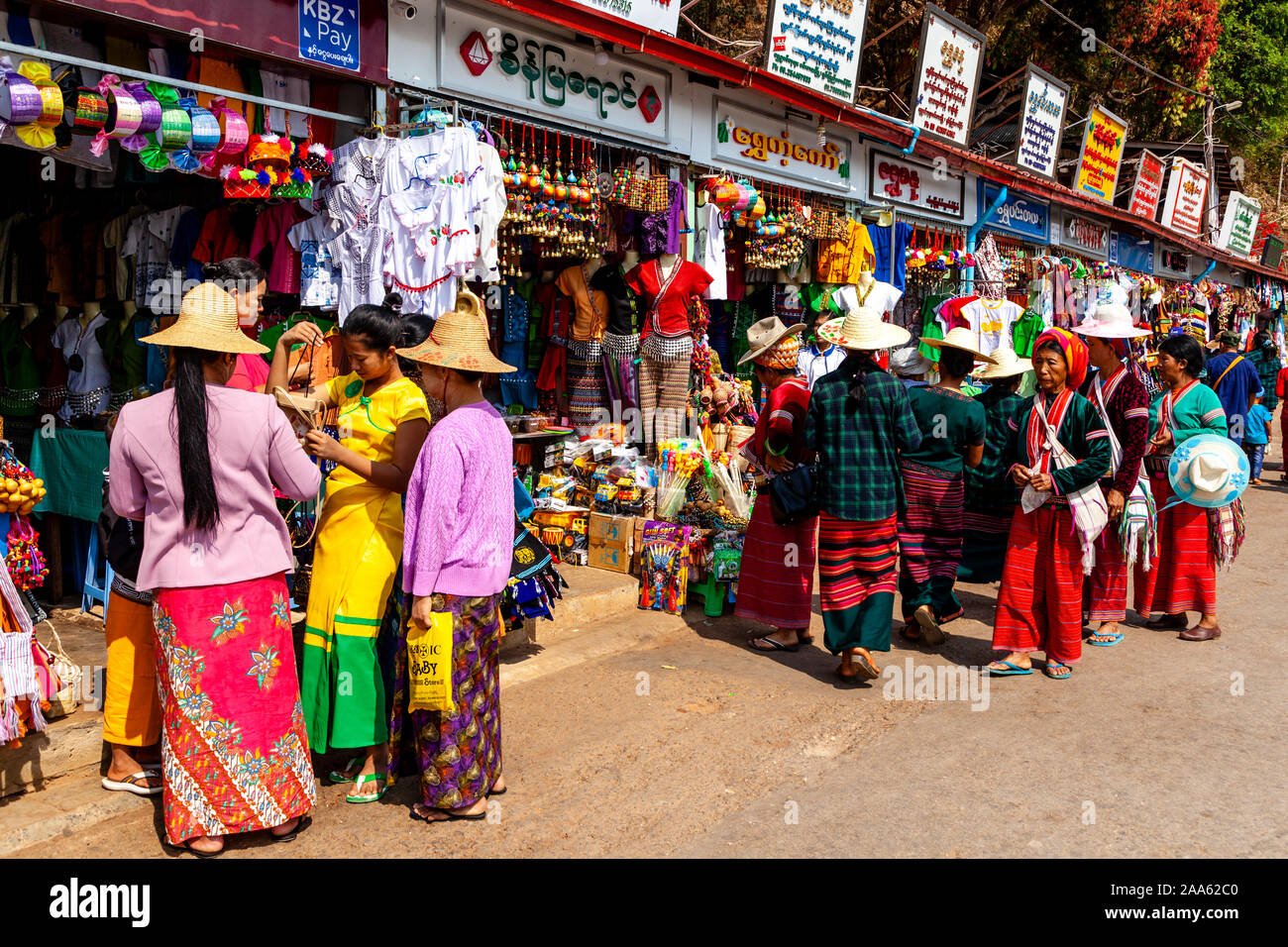 A Group Of Ethnic Minority People Shopping, Pindaya, Shan State, Myanmar. Stock Photo