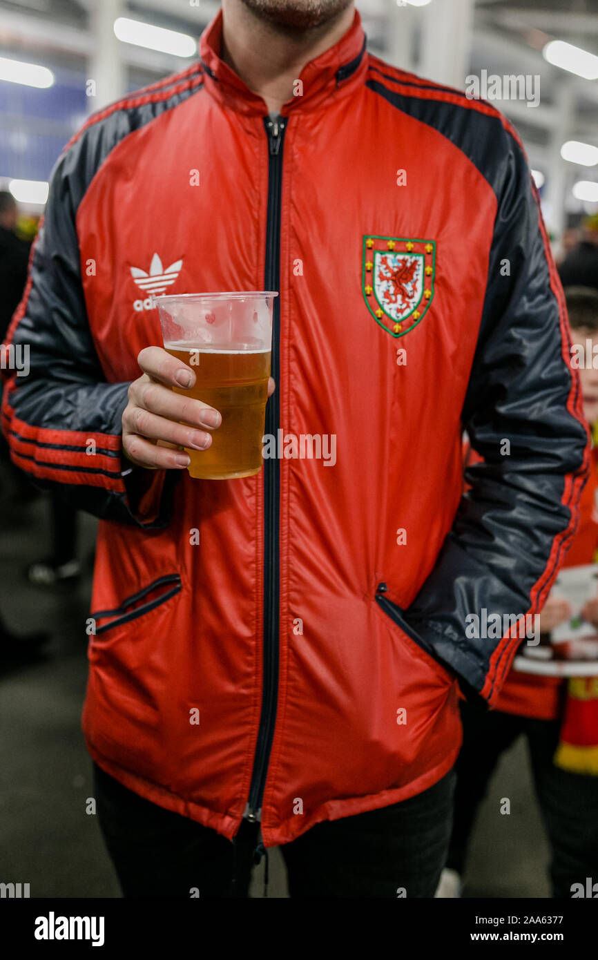 CARDIFF, WALES - NOVEMBER 13: Welsh fan in retro Adidas welsh jacket during  the EUFA Euro 2020 qualifier between Wales and Hungary at Cardiff City Sta  Stock Photo - Alamy