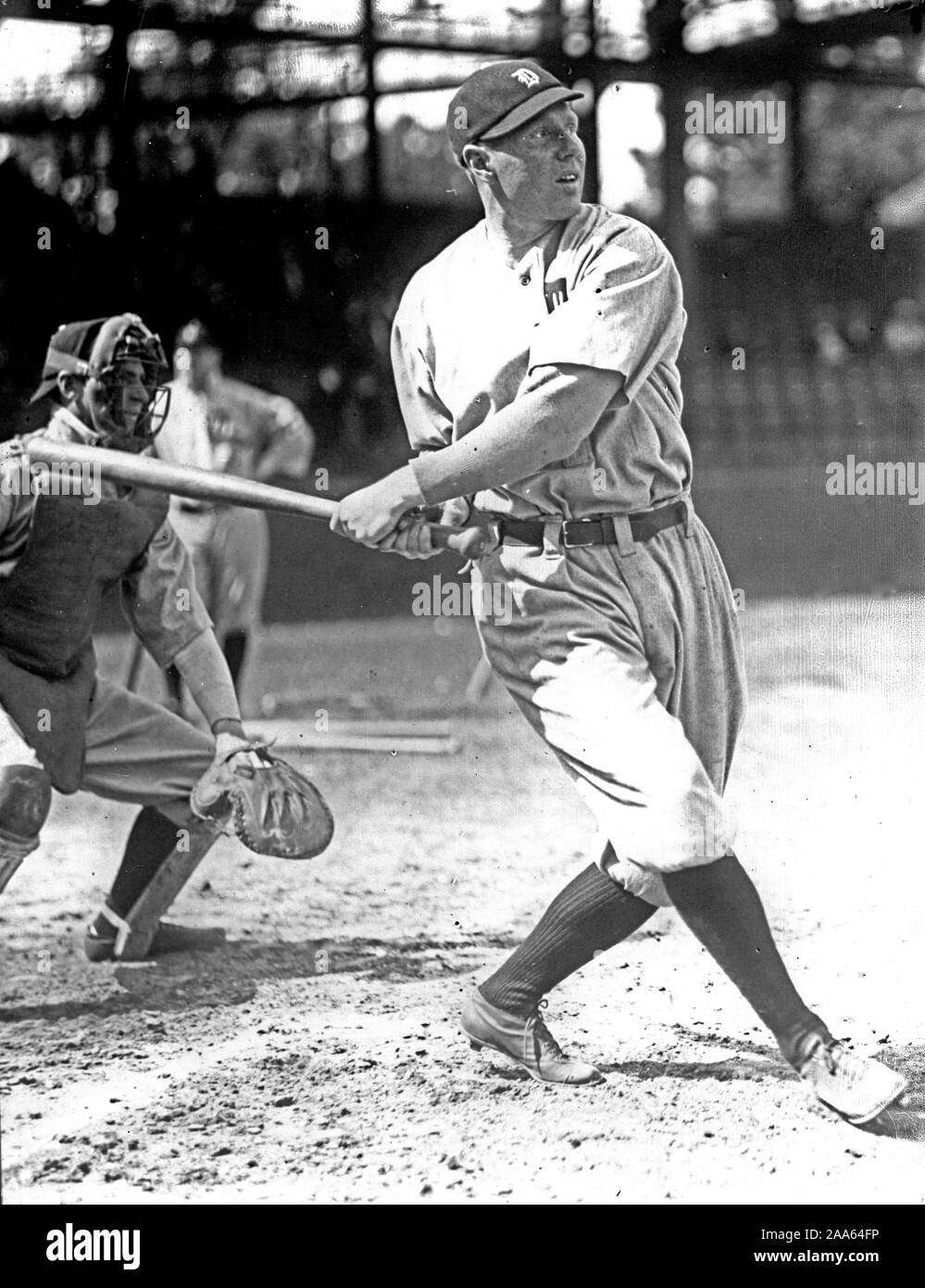 Baseball player swinging a bat in a game ca. 1909-1923 Stock Photo