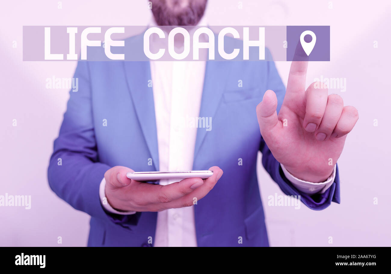Handwriting text writing Life Coach. Conceptual photo someone who helps identify your goals and plan to achieve them Businessman in the blue suite wit Stock Photo