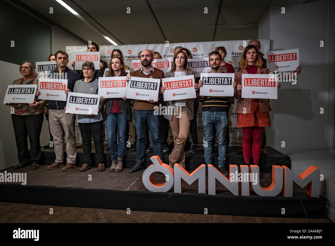 Members of the National Board of Òmnium Cultural holding placards during a press conference. After Amnesty International's public statement about the unfair prison situation of Catalan political prisoners Jordi Cuixart and Jordi Sànchez, the National Board of Òmnium Cultural, of which Jordi Cuixart is president, has made an institutional declaration demanding immediate release of the prisoners and the annulment of the sentence. Stock Photo