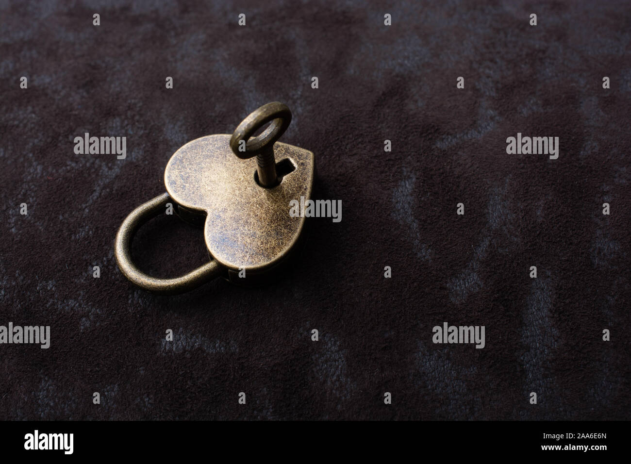 Metal padlock in heart shape as symbol of love Stock Photo - Alamy