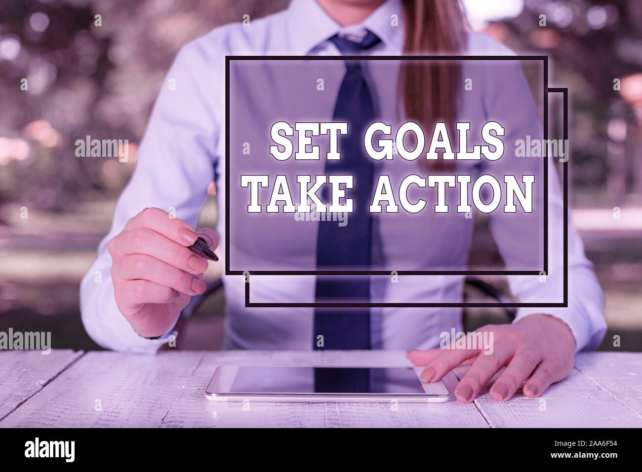 Text sign showing Set Goals Take Action. Business photo showcasing Act on a specific and clearly laid out plans Female business person sitting by tabl Stock Photo