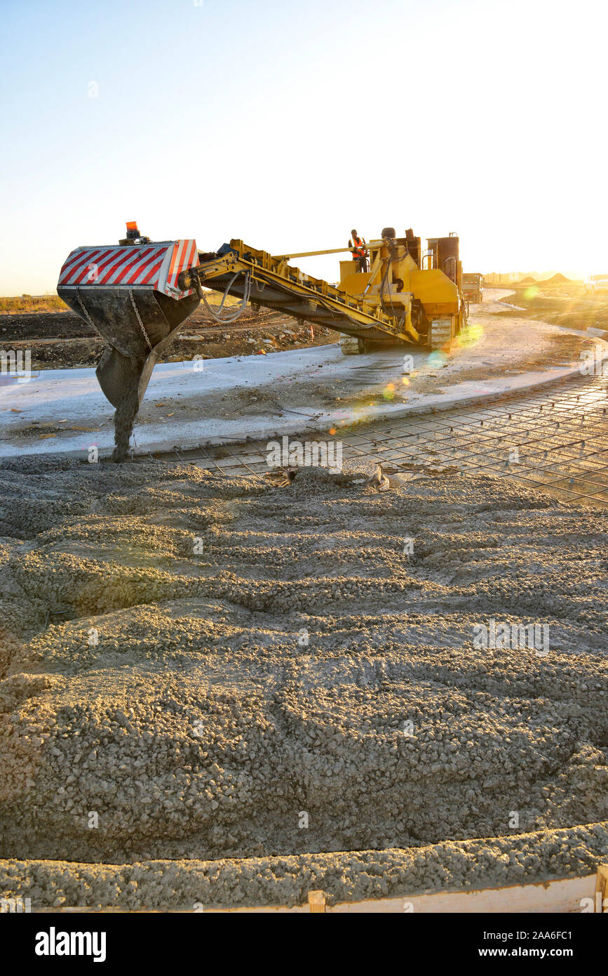 Heavy Machinery making concrete to pave new streets. Stock Photo