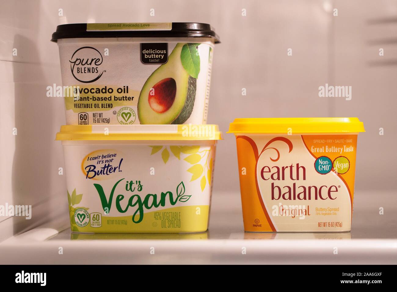 Vegan non-dairy products on a refrigerator shelf. Stock Photo