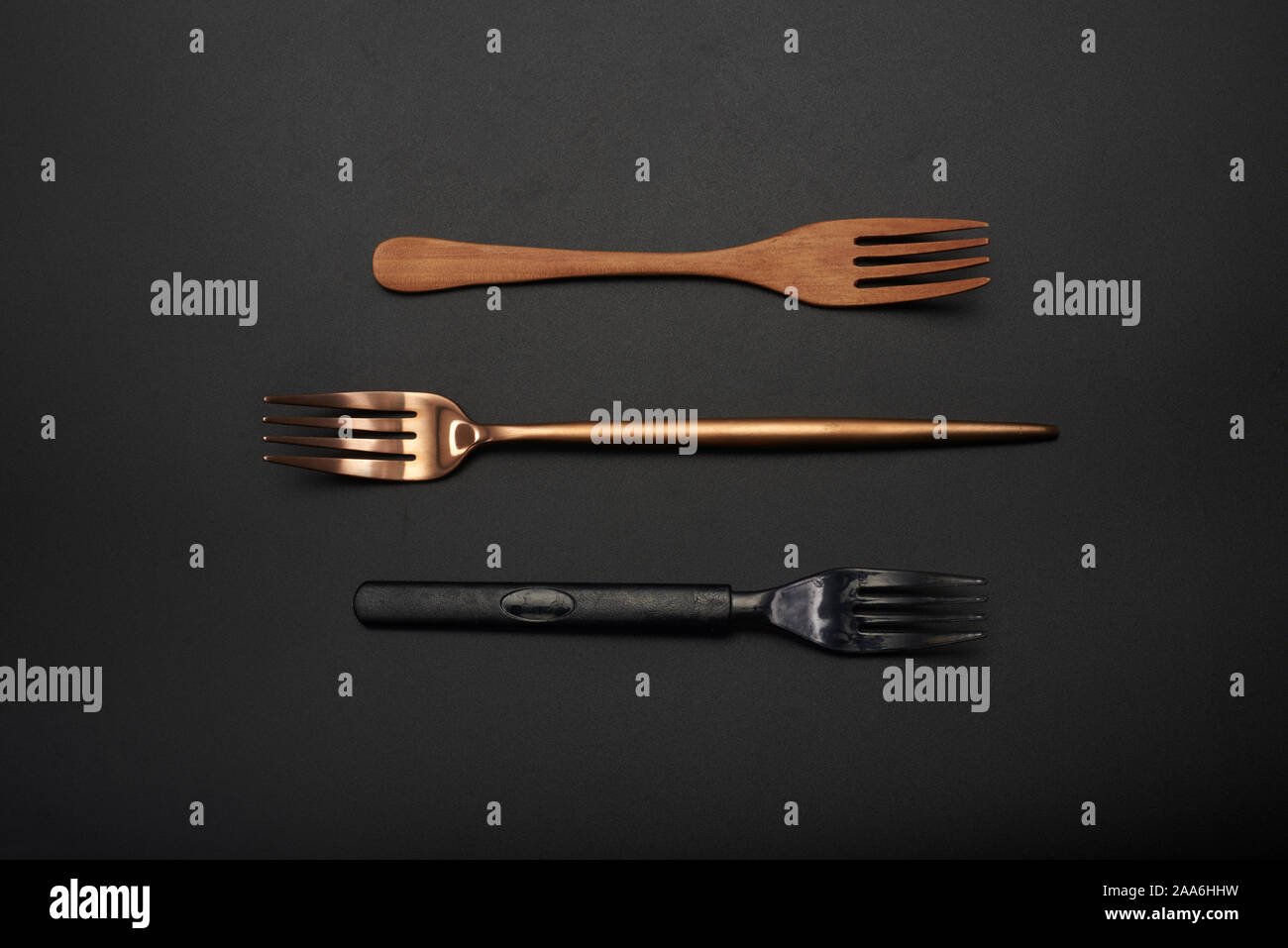 Three different material forks, wooden forks, long handle gold metal