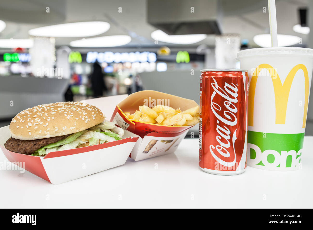 McDonald's Big Mac 100% pure beef sandwiched with refreshing Coca-Cola Coke, big yellow McDonald's M sign, logo on cup, French fries Stock Photo