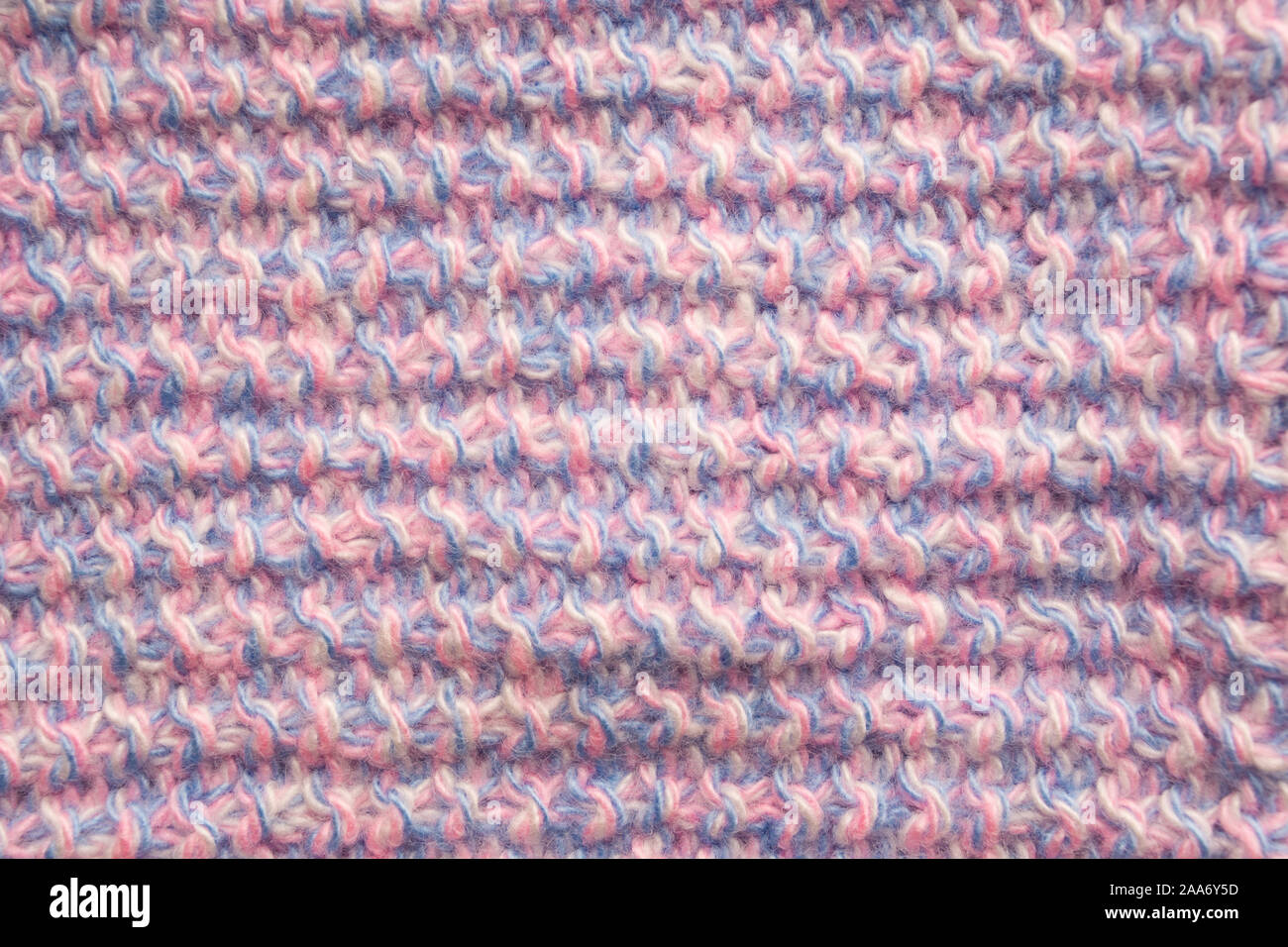 Pink and blue woolen textured pattern background. Material textile surface for clothes. Fashion handmade backdrop. Horizontal stripes Stock Photo