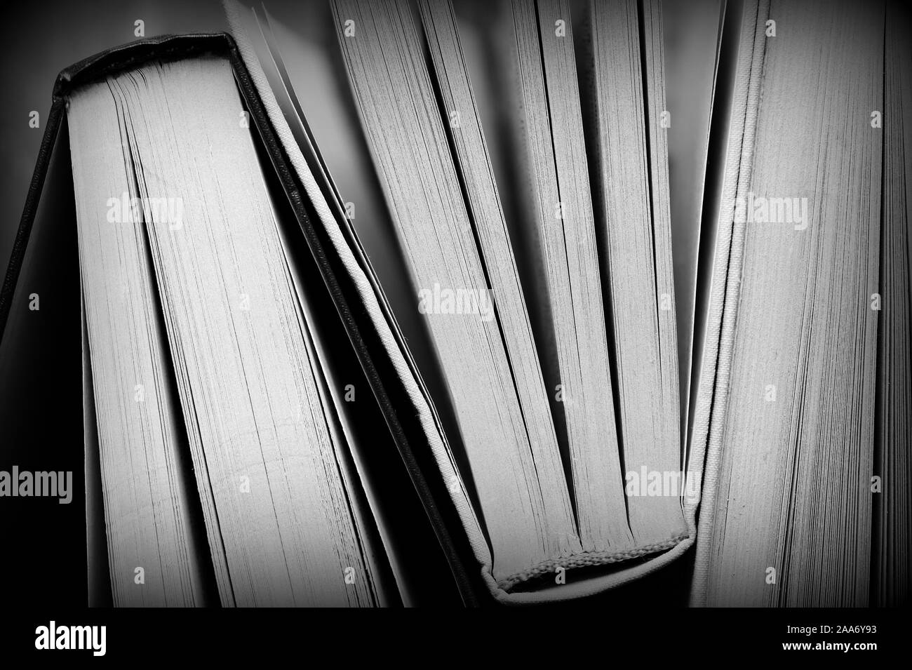 Several old books close up. Monochrome educational background Stock Photo