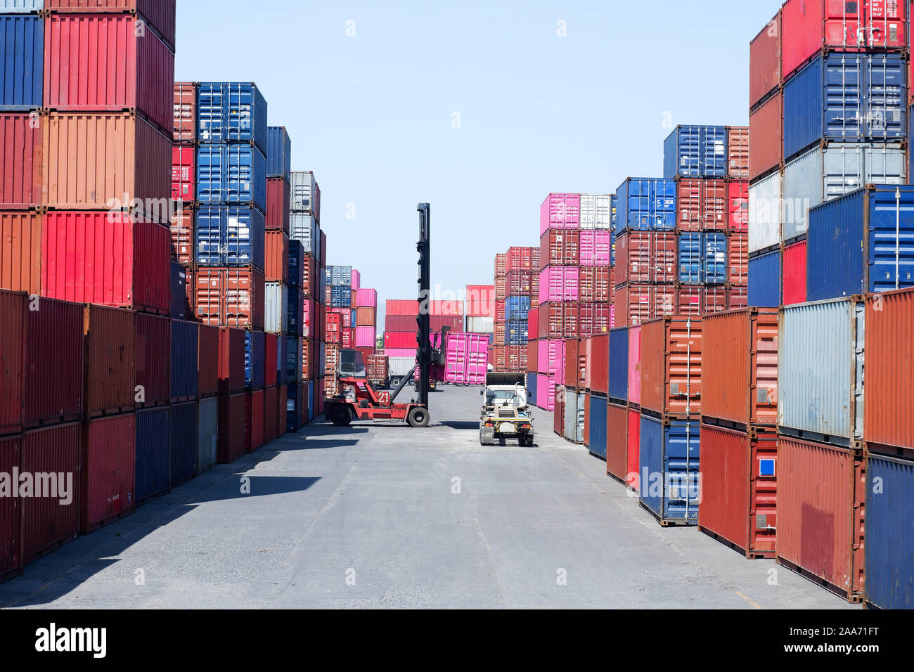 Container handlers In the shipping dock with storage cabinet background, industrial ideas Import and export Stock Photo
