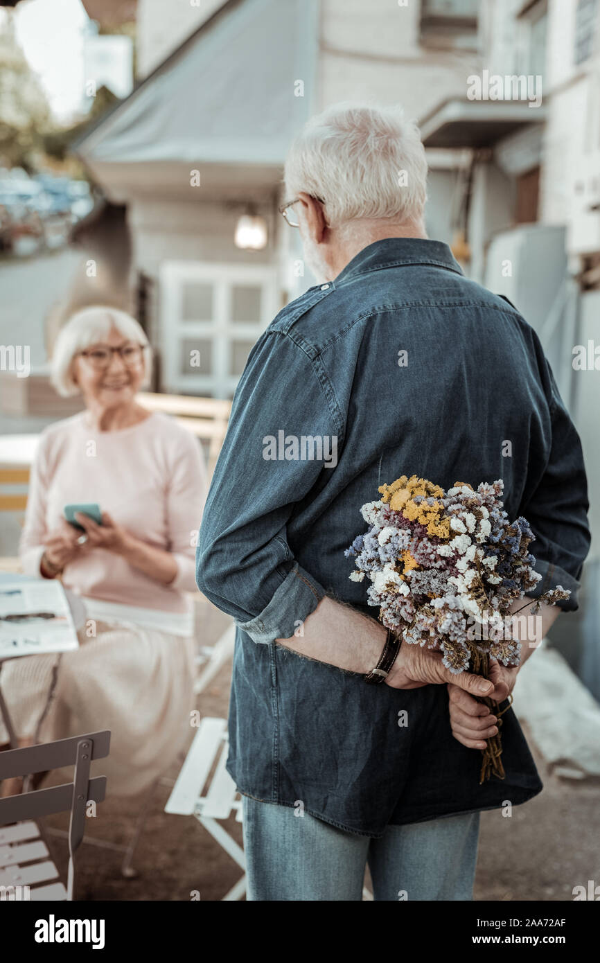 Beautiful nice bouquet being in male hands Stock Photo