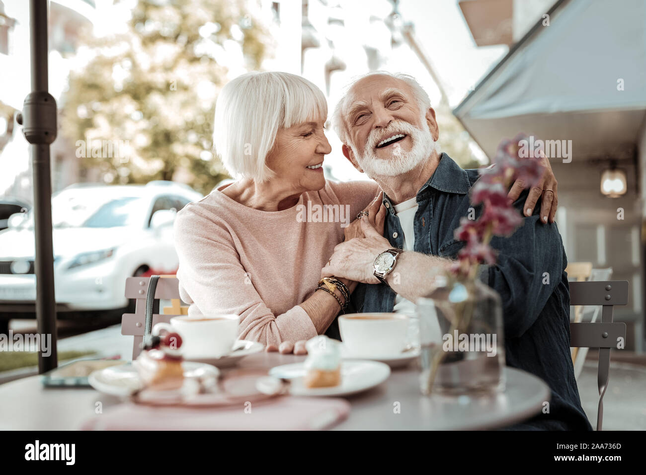 Nice happy couple sitting together in the cafe Stock Photo