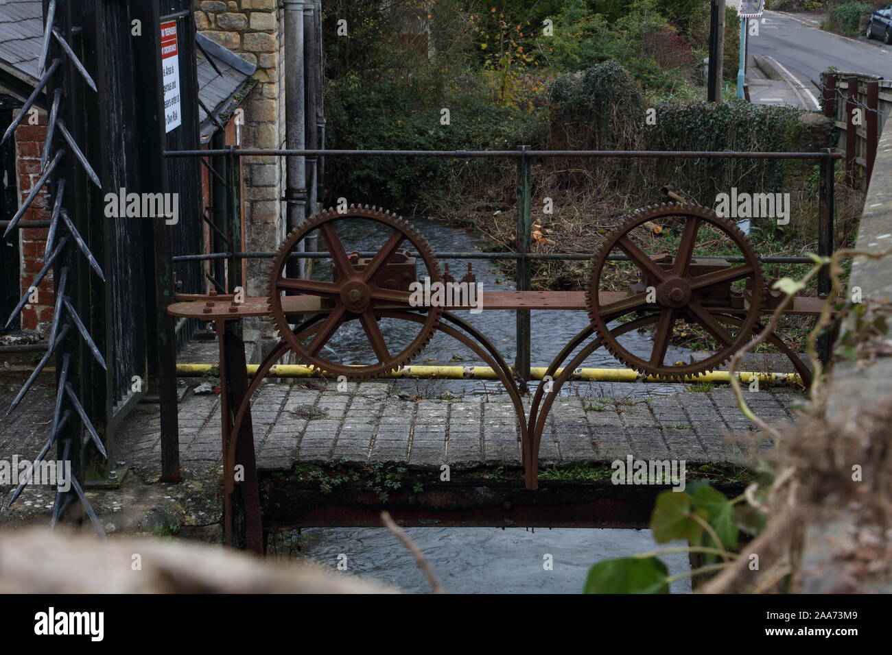 Two old toothed wheels stand idle with the racks they operated to ...