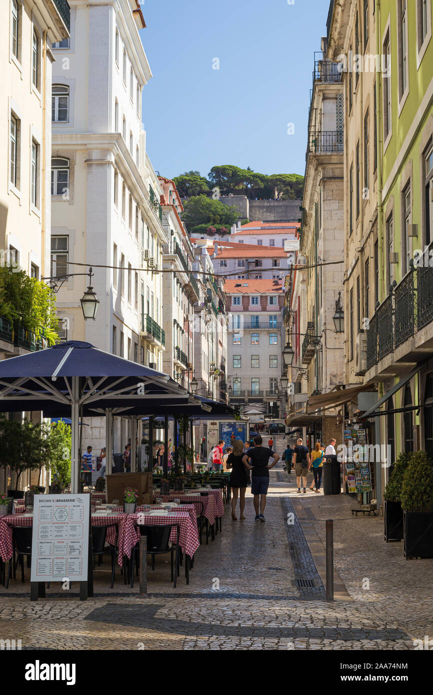 Cityscape towards Sao Jorge Castle on the Rua da Assuncao pedestrian street in the Baixa district, Lisbon's historical centre, in the summer. Stock Photo