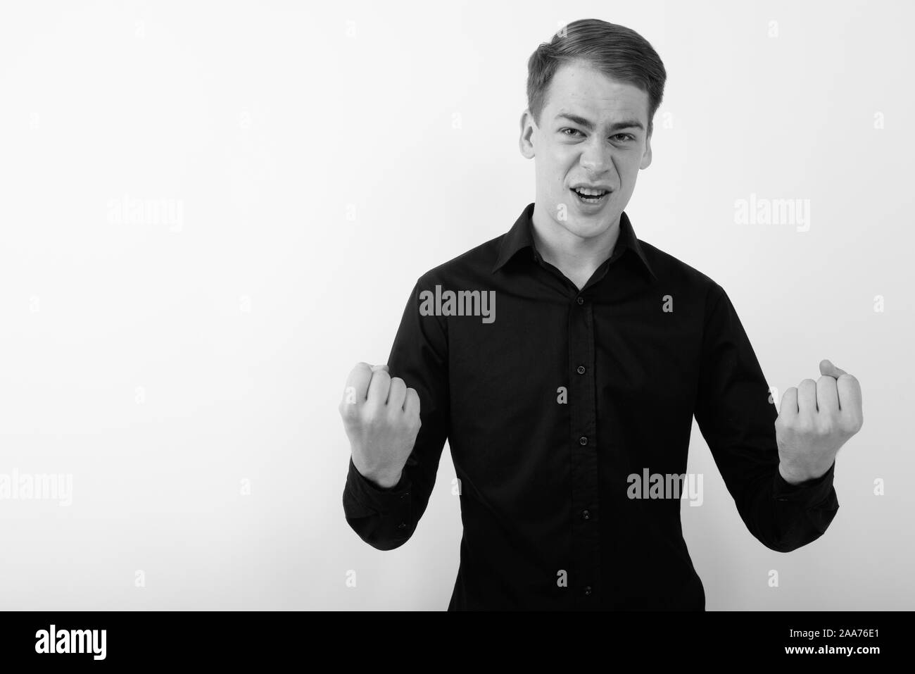 Portrait young angry businessman Black and White Stock Photos & Images ...