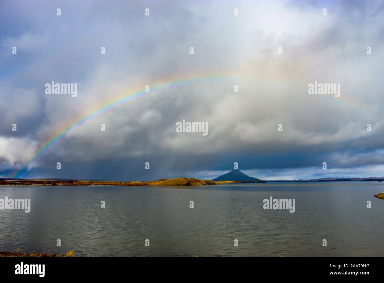 Lake Myvatn in Iceland with beautiful rainbow and rain Stock Photo