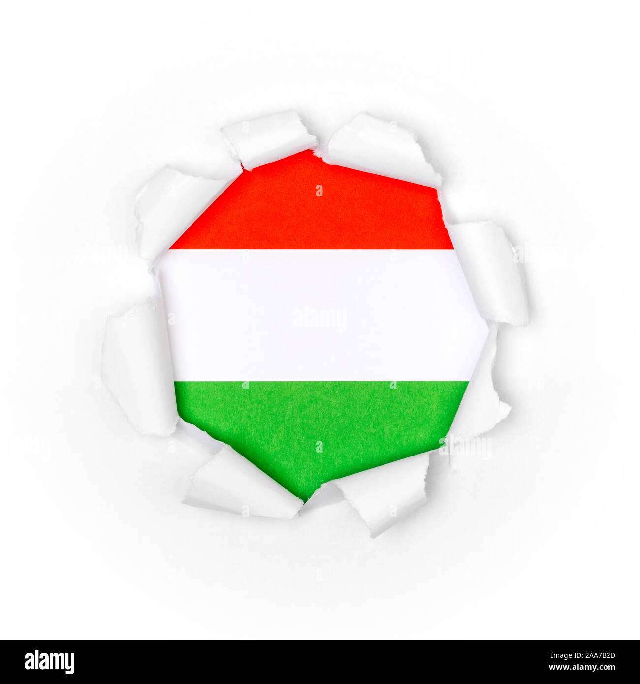View of the hungarian flag through the big breakthrough in the paper. Stock Photo