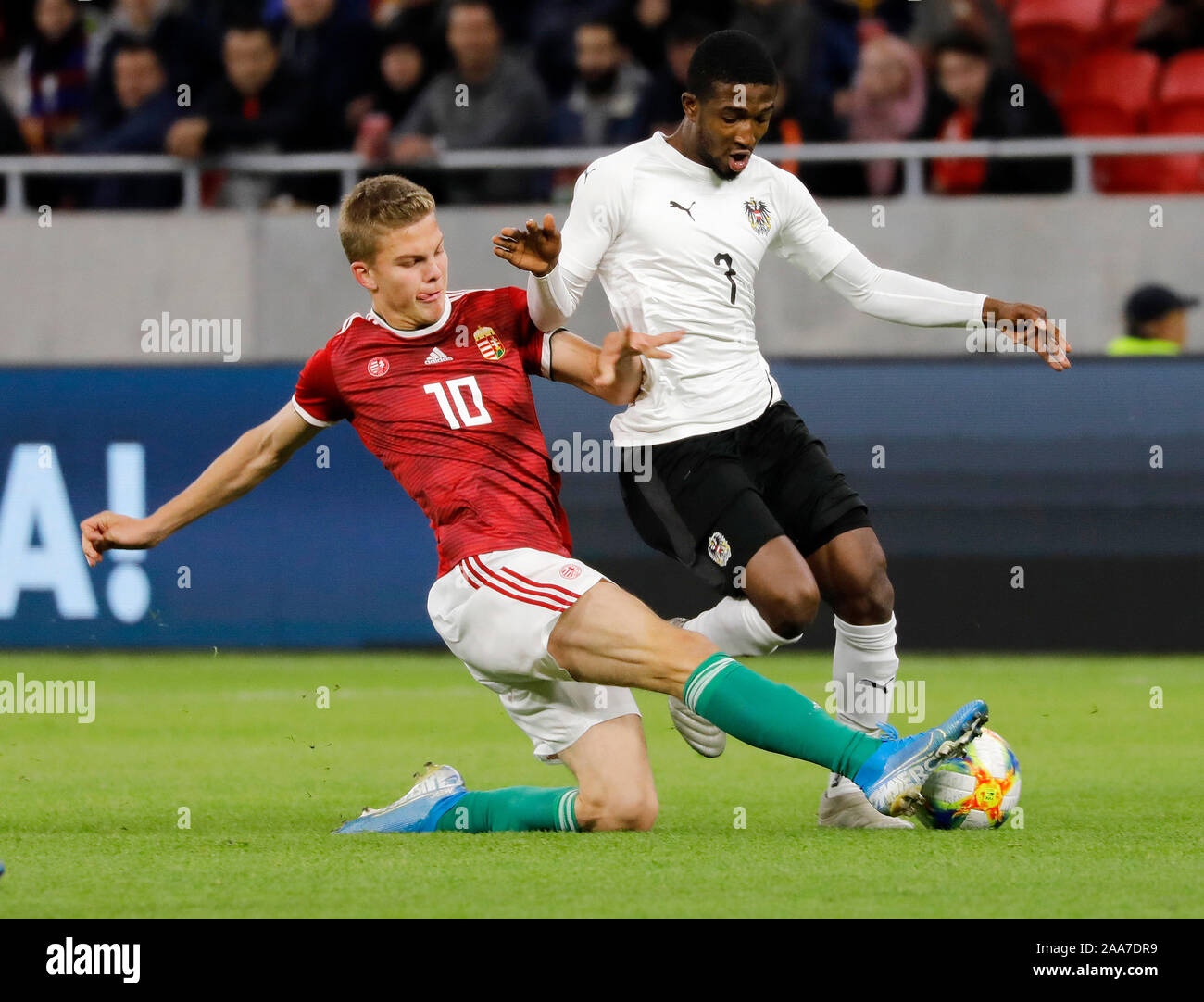 BUDAPEST, HUNGARY - NOVEMBER 18: (l-r) Andras Schafer of Hungary U21 challenges Kelvin Arase of Austria U21 during the International Friendly match between Hungary U21 and Austria U21 at Puskas Arena on November 18, 2019 in Budapest, Hungary. Stock Photo